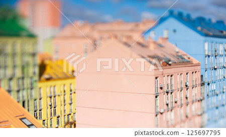 Vibrant tilt-shift image showcasing the colorful modern residential architecture of Comfort Town 125697795