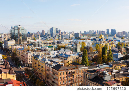 Elevated view of the Kyiv cityscape, prominently featuring the historic St Volodymyr's Cathedral 125697810