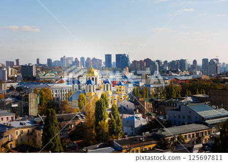 Elevated view of the Kyiv cityscape, prominently featuring the historic St Volodymyr's Cathedral Elevated view of the Kyiv cityscape, prominently featuring the historic St Volodymyr's Cathedral 125697811