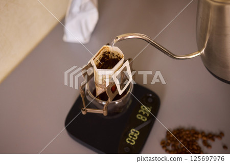 Brewing Coffee with a Precision Pouring Kettle for an Enhanced Experience and Enjoyment 125697976