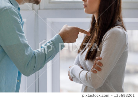 Man accusing woman during conflict at home 125698201