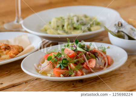 Food and wine on a restaurant table, Italian 125698224
