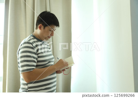 East Asian Man 125699266