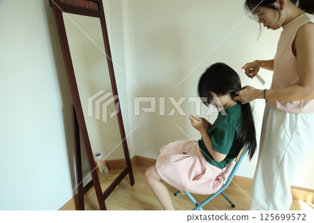 East Asian Girl with Mom 125699572