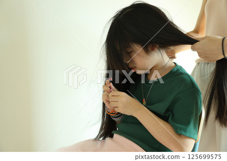 East Asian Girl with Mom East Asian Girl with Mom 125699575