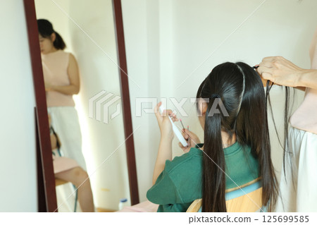 East Asian Girl with Mom East Asian Girl with Mom 125699585