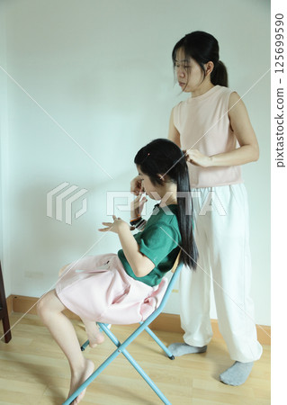 East Asian Girl with Mom 125699590