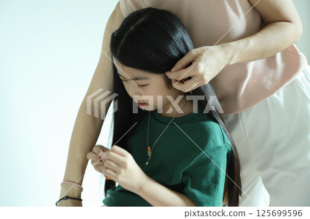 East Asian Girl with Mom 125699596