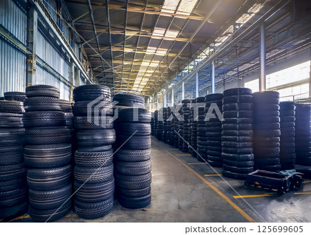 Many tires piled up at a tire recycling plant 125699605