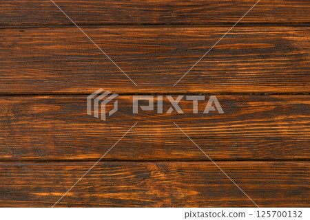Dark brown wooden background, wood texture top view 125700132