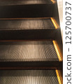 abstract escalator in shopping mall 125700737
