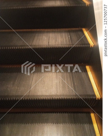 abstract escalator in shopping mall 125700737