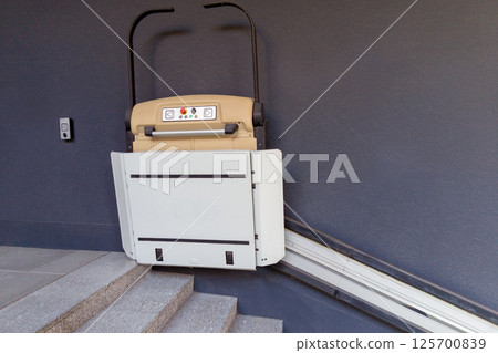 Wheelchair Platform Lift on Modern Staircase 125700839