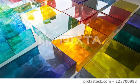 A colorful mosaic of glass pieces with a variety of colors 125700988