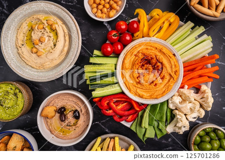 Various hummus dips, healthy and vegan snack 125701286