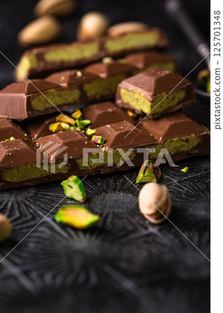 Dubai chocolate with kadayif pistachio filling Dubai chocolate with kadayif pistachio filling 125701348