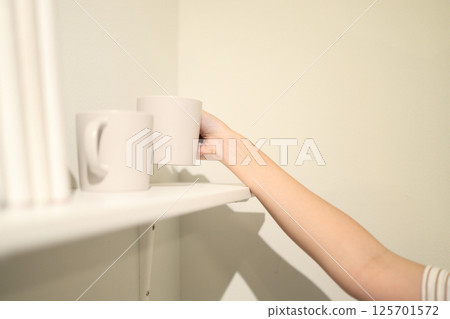 Coffee Mug on the Shelf 125701572