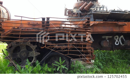 Rusty and burned-out armored vehicles on ukrainian territory. Exhibition of destroyed military equipment of the russian army. War between Ukraine and russia. Close up Slow motion 125702455
