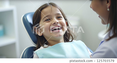 Child at the dentist, checking the health of the oral cavity in children and maintaining dental health 125703579