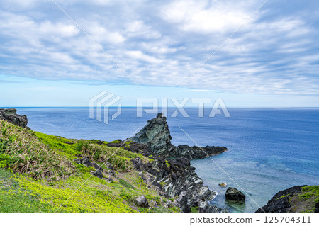 A magnificent seascape seen from Okanzaki under a cloudy sky, Fuchibuiwa Rock, Ishigaki Island A magnificent seascape seen from Okanzaki under a cloudy sky, Fuchibuiwa Rock, Ishigaki Island 125704311