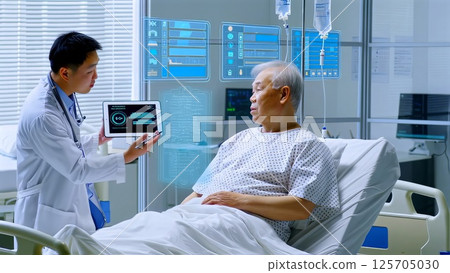 Asian doctor showing futuristic medical interface on digital tablet and explaining diagnosis to senior patient lying in hospital bed, innovative medical treatment and technology concept 125705030