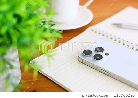 Coffee break, cafe table, Umaho and ring notebook 125706286