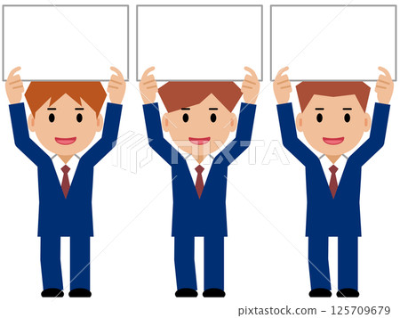 A young man in a navy blue suit holding up a board 125709679