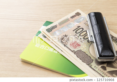 Passbook, seal and cash 125710908