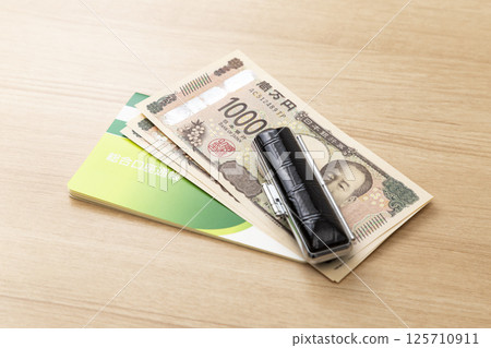 Passbook, seal and cash 125710911