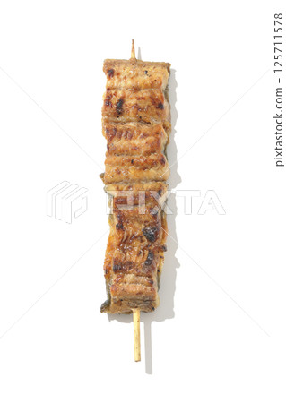 Grilled eel skewers photographed on a white background Grilled eel skewers photographed on a white background 125711578