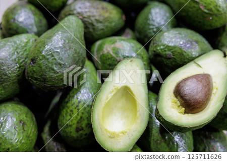 Freshly harvested avocados 125711626