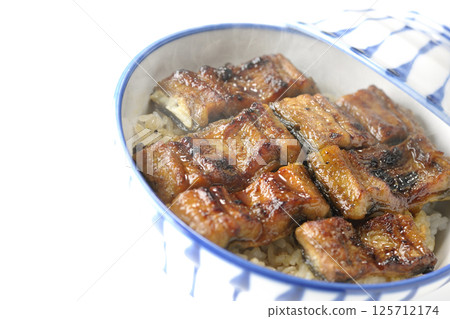 Hot eel bowl photographed on white background Hot eel bowl photographed on white background 125712174