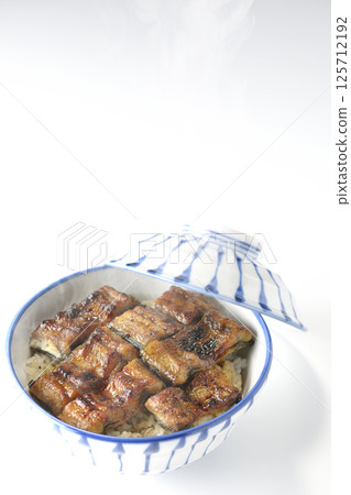 Hot eel bowl photographed on white background 125712192