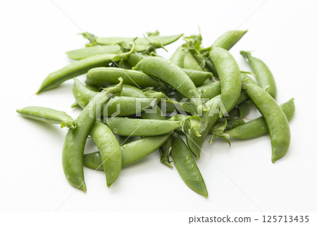 Peas on a white background Peas on a white background 125713435