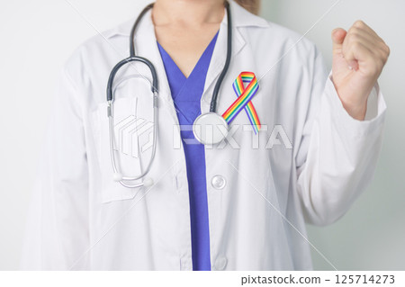 Doctor with LGBTQ Rainbow ribbon for Support Lesbian, Gay, Bisexual, Transgender and Queer community and happy Pride month concept Doctor with LGBTQ Rainbow ribbon for Support Lesbian, Gay, Bisexual, Transgender and Queer community and happy Pride month concept 125714273