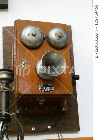 A retro telephone with a cute robot face from the nostalgic early Showa era 125714459
