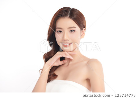 A beautiful young Asian woman with clean, fresh skin against a white background. Skincare, facial treatment, cosmetology, beauty, and spa. An elegant portrait of an Asian woman. A beautiful young Asian woman with clean, fresh skin against a white background. Skincare, facial treatment, cosmetology, beauty, and spa. An elegant portrait of an Asian woman. 125714773