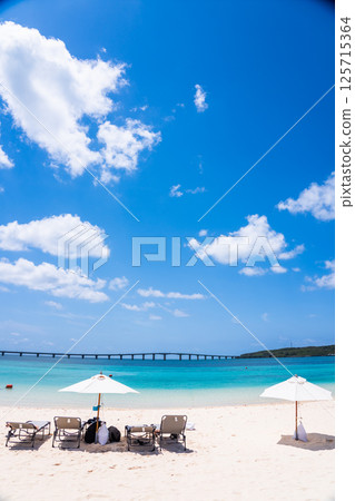 (Image of a beach resort) Blue sea and white sand (Image of a beach resort) Blue sea and white sand 125715364