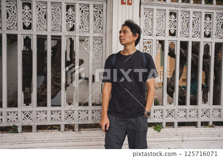 solo travel with man chilling see city life in bangkok thailand in summer season 125716071