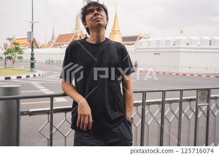 solo travel with man chilling see city life in bangkok thailand in summer season 125716074
