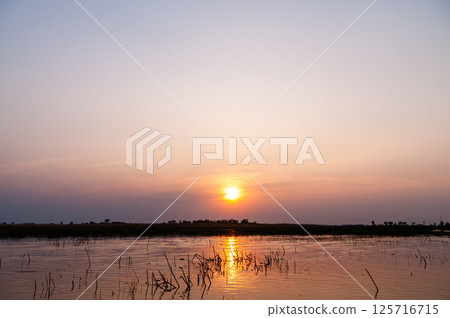 Sunset on the Okavango Delta Sunset on the Okavango Delta 125716715