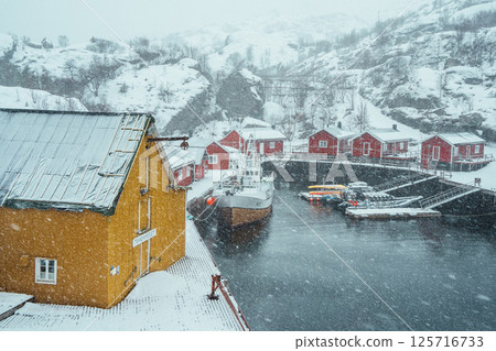 Nusfjord Harbor with Colorful Cabins and Boat. Lofoten. Nusfjord Harbor with Colorful Cabins and Boat. Lofoten. 125716733