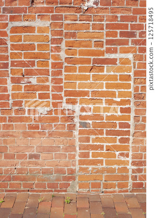 Reddish brick wall with the outline of a bricked-up window and a bricked-up door, bricks, background, Germany, Europe 125718495