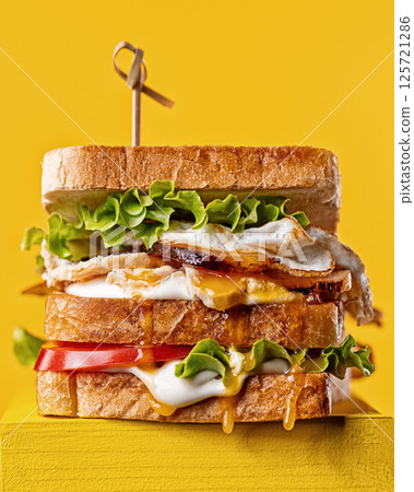 club sandwich on yellow background club sandwich on yellow background 125721286