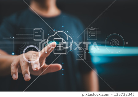 A user interacts with a virtual document system, symbolizing modern paperless environments and digital operations. 125722345