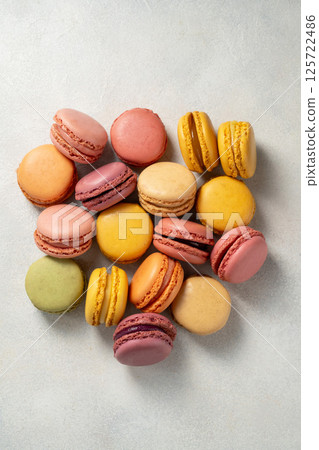 Macarons cookies, french macarons on bright background. Sweet dessert, sugar Macarons cookies, french macarons on bright background. Sweet dessert, sugar 125722486
