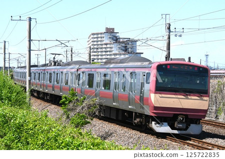 A red-colored E531 series train on the Joban Line heading towards Shinagawa A red-colored E531 series train on the Joban Line heading towards Shinagawa 125722835