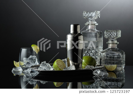 Shaker with crushed ice, lime and vodka. 125723197