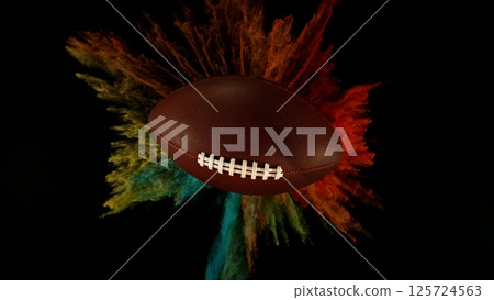 Football ball with coloured powder explosion. Football ball with coloured powder explosion. 125724563