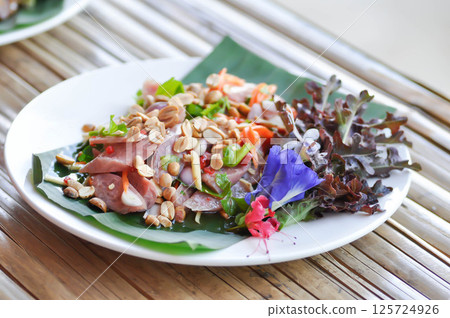 pickled pork sausage, fermented pork salad or sausage salad or spicy salad or Thai spicy salad or Thai sausage salad with peanut and vegetable 125724926